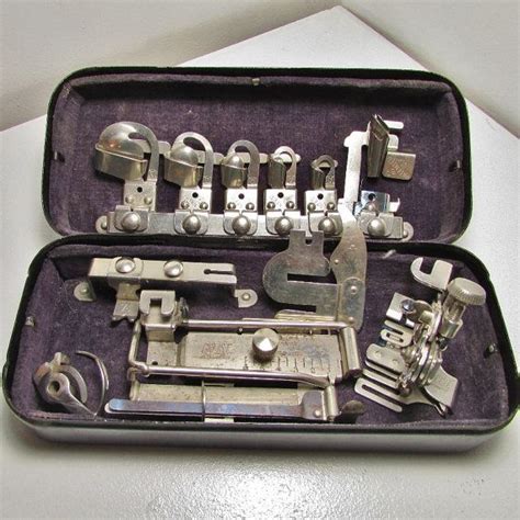 Rotary black metal box with sewing attachments 